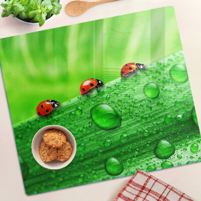 Tocător de bucătărie Buburuze pe un fundal verde