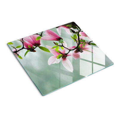 Tocător sticlă Flori de magnolie pe un fundal verde