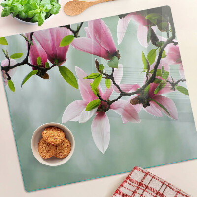 Tocător sticlă Flori de magnolie pe un fundal verde