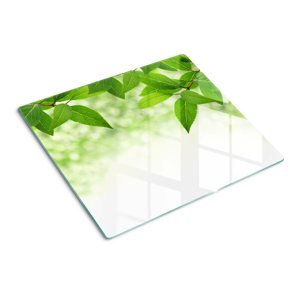 Tocător de bucătărie Frunze pe un fundal verde neclar