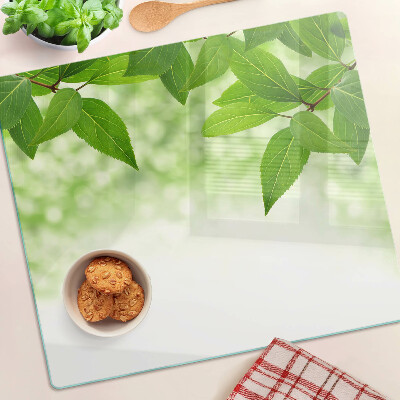 Tocător de bucătărie Frunze pe un fundal verde neclar