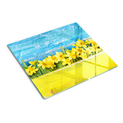 Tocător sticlă Flori de narcisă pe fundalul cerului