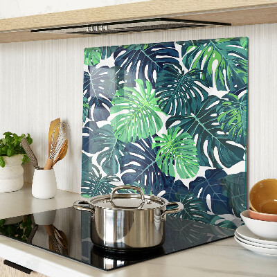 Tocător sticlă Frunze de Monstera pe un fundal tropical