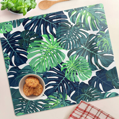 Tocător sticlă Frunze de Monstera pe un fundal tropical