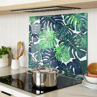 Tocător sticlă Frunze de Monstera pe un fundal tropical