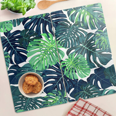 Tocător sticlă Frunze de Monstera pe un fundal tropical