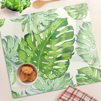 Tocător sticlă Frunze de Monstera pe un fundal deschis