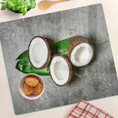 Tocător sticlă Nucă de cocos pe fundal de beton