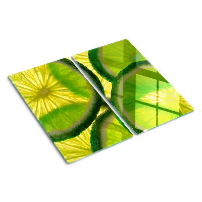 Tocător sticlă Felii de lime pe fundal verde