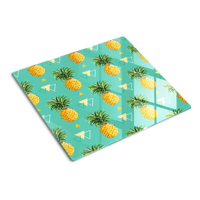 Tocător de bucătărie Ananas pe un fundal turcoaz