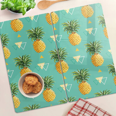 Tocător de bucătărie Ananas pe un fundal turcoaz