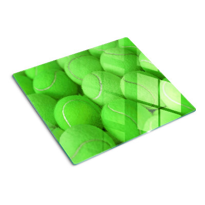 Tocător de bucătărie Mingi de tenis pe un fundal verde