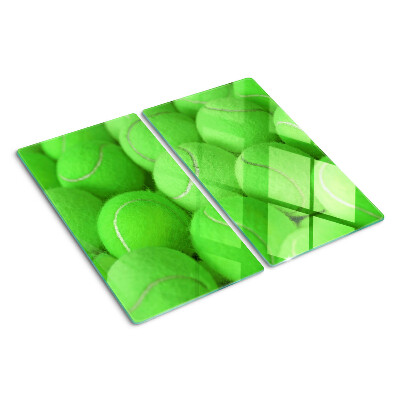 Tocător de bucătărie Mingi de tenis pe un fundal verde