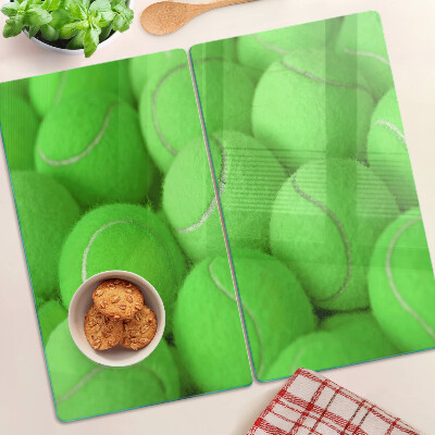 Tocător de bucătărie Mingi de tenis pe un fundal verde