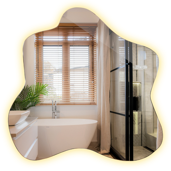 Oglindă în formă de pată iluminată cu LED-uri