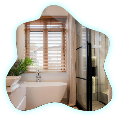 Oglindă în formă de pată iluminată cu LED-uri