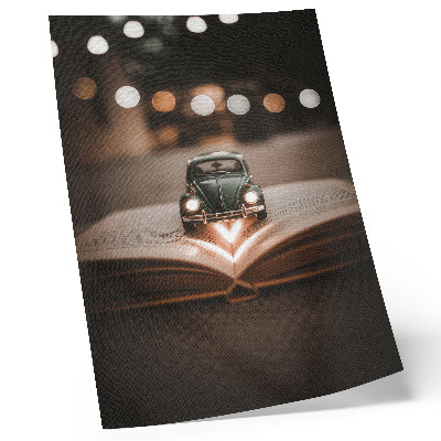 Poster rezistent pentru perete Mașină în miniatură pe o carte cu lumini magice