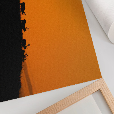 Poster retro Siluete de cerbi pe un deal cu fundal portocaliu