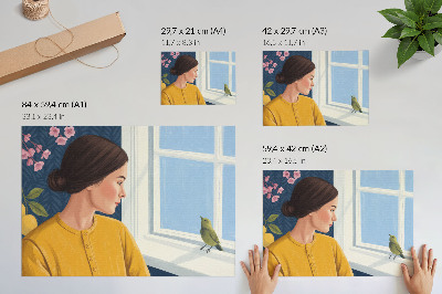 Poster pentru perete Femeie într-o cămașă galbenă cu o pasăre pe pervaz